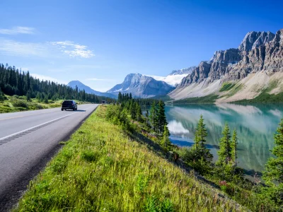 Car driving along the Icefields Parkway near Banff