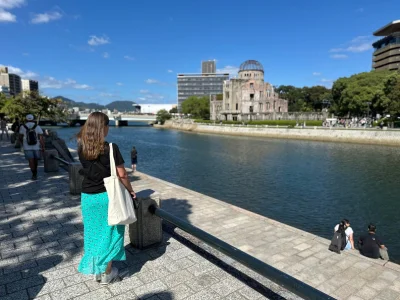Woman looking at the Atomic Bomb Dome in Hiroshima, Japan
