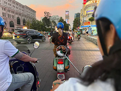 Michelle from TourCompass on a Vespa in Ho Chi Minh City