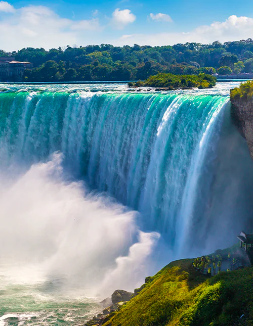 View from the Canadian side of Niagara Falls: Horseshoe Falls on a sunny day in Niagara Falls, Ontario, Canada