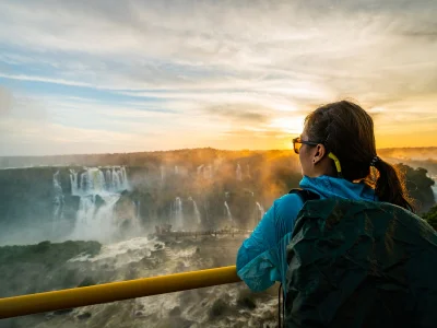 Women watching the sunset at Iguazú Falls on the Brazilian side