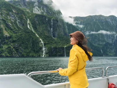 Woman sailing in Milford Sound, New Zealand