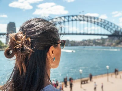 Woman looking at Sydney Harbour Bridge in Sydney, Australia