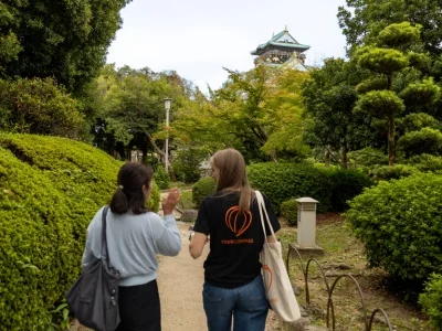 Japanese guide and TourCompass employee walking in Osaka, Japan