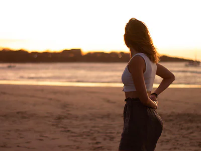 Woman enjoying the sunset on Tamarindo Beach in Costa Rica