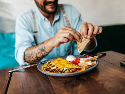 Man sitting with an American breakfast