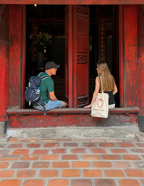 Man and woman at the Temple of Literature in Hanoi, Vietnam