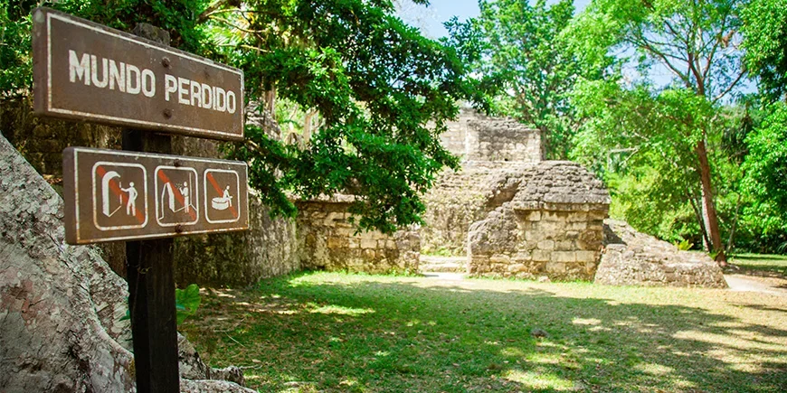 Sign with directions in front of a ruin in Tikal National Park
