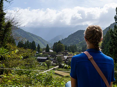 Woman overlooking the beautiful village of Gokayama