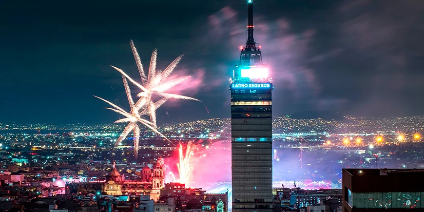 A view of Mexico City in the evening on Independence Day, with fireworks lighting up the sky in beautiful colours