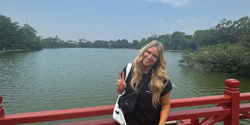 Millie standing in front of Hoan Kiem Lake
