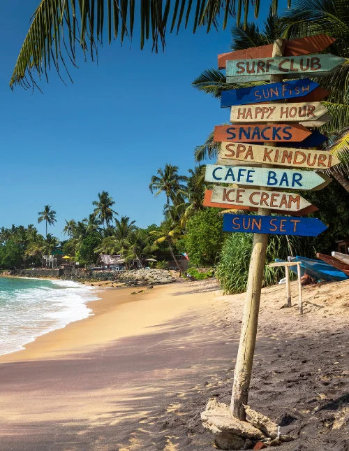 Colorful wooden sign at the beach in Mirissa, southern province, Sri Lanka