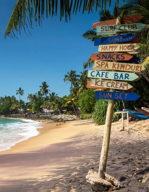 Colorful wooden sign at the beach in Mirissa, southern province, Sri Lanka