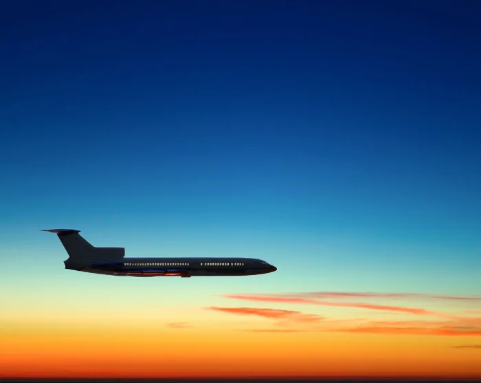 Fly across the sky at sunset