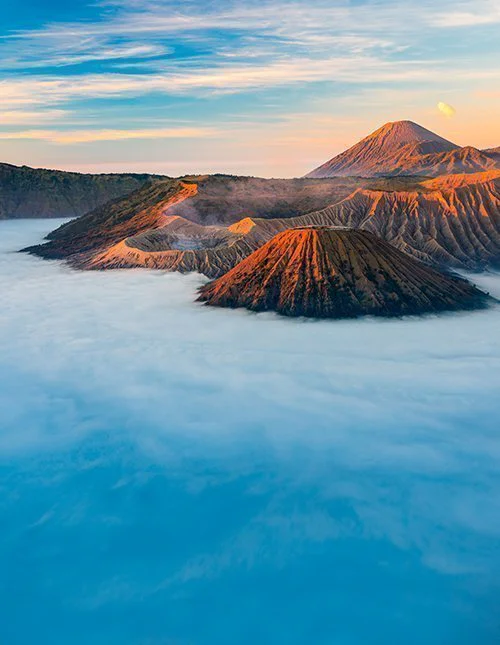 Bromo volcano mountain at sunrise in East Java, Indonesia surrounded by morning fog