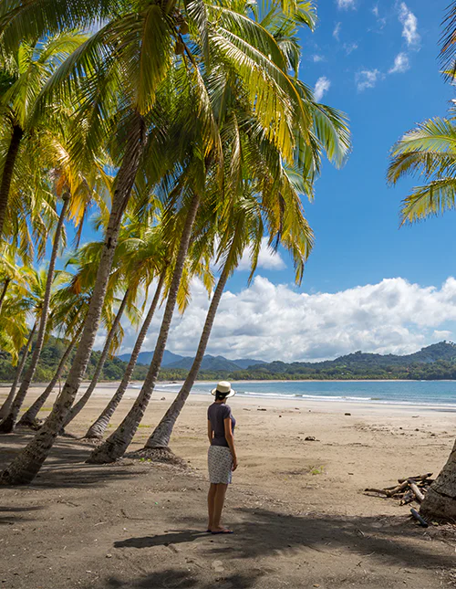 A woman enjoys the view over the water at Playa Samara