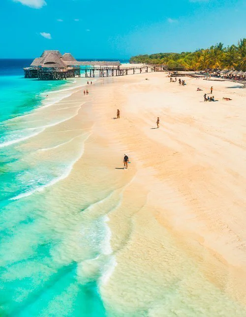 Aerial view of sandy beach of Indian Ocean at sunset.