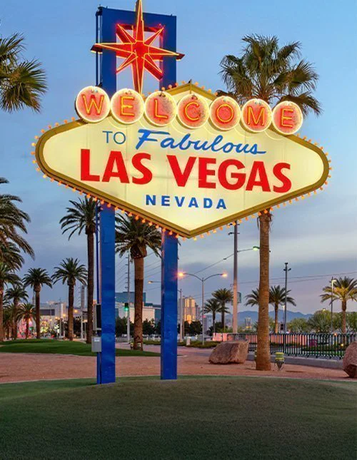 Las Vegas, Nevada, USA, by the Welcome to Las Vegas sign at dusk.