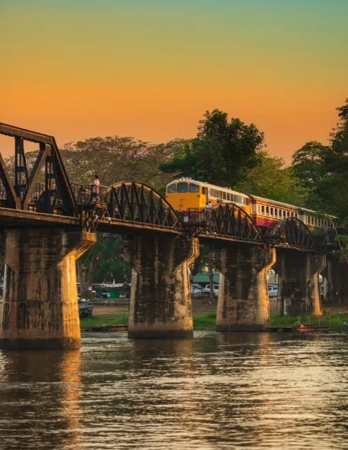 Train on River Kwai bridge in Kanchanaburi Thailand